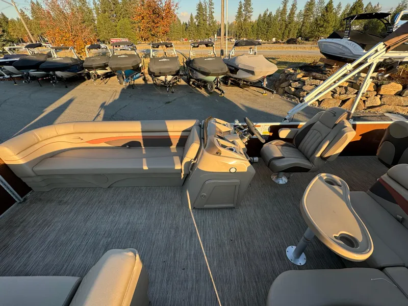 Slide: The Image of 2023 Bennington 22 SS pontoon boat interior with seating and steering console. - 9