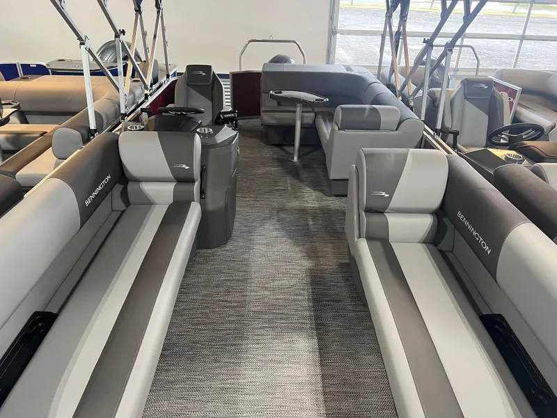 Slide: The Image of 2024 Bennington 22 SVL pontoon boat interior with gray seating and modern design. - 6