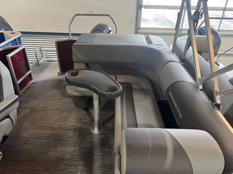 Slide: The Image of 2024 Bennington 22 SVL pontoon boat interior with gray seating and table. - 7