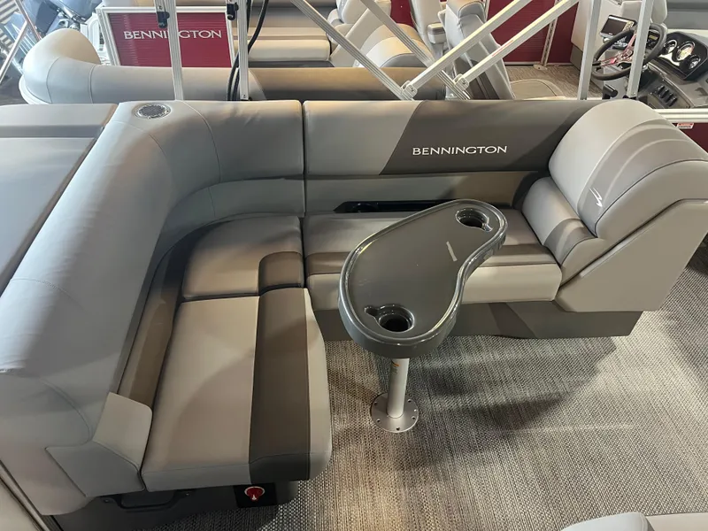Slide: The Image of 2024 Bennington 22 SVL boat interior with gray seating and table. - 8