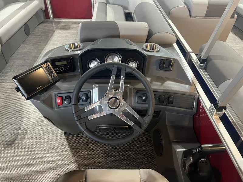 Slide: The Image of 2024 Bennington 22 SVL boat dashboard with steering wheel and control panel. - 9