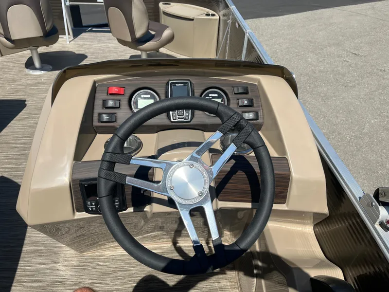 Slide: The Image of Steering console of 2023 Bennington 22 SXFAPG boat with modern controls and dashboard. - 13