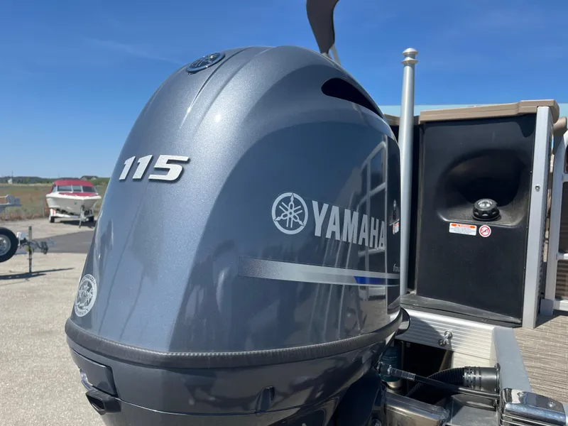 Slide: The Image of Yamaha 115 outboard motor on 2023 Bennington 22 SXFAPG boat, sunny day. - 15