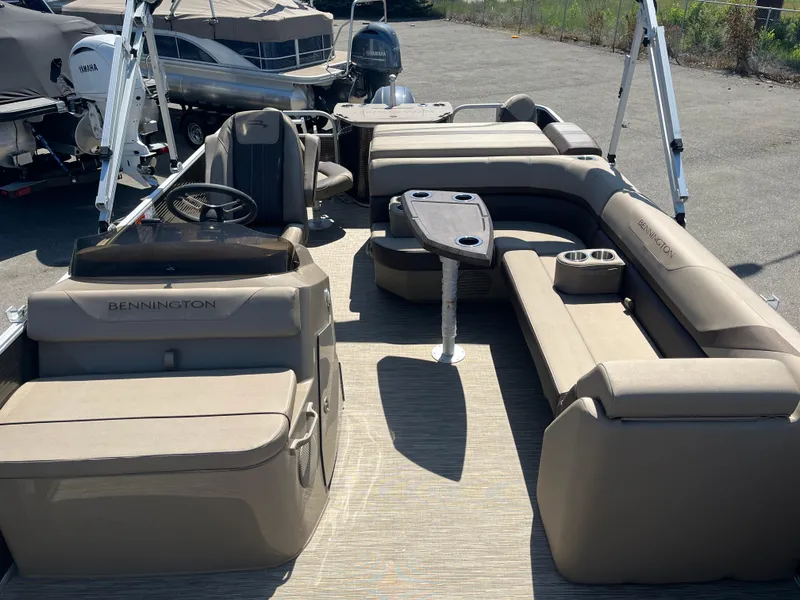 Slide: The Image of 2023 Bennington 22 SXFAPG pontoon boat interior with seating and steering console. - 8