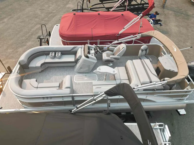 Slide: The Image of 2023 Bennington 22 SXSAPG pontoon boat with spacious seating and modern design. - 1