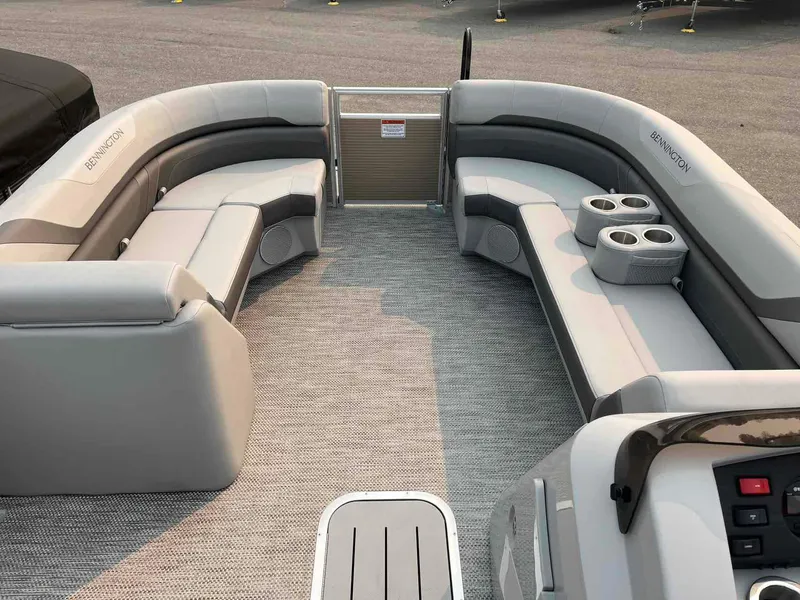 Slide: The Image of 2023 Bennington 22 SXSAPG pontoon boat interior with plush seating and cup holders. - 10