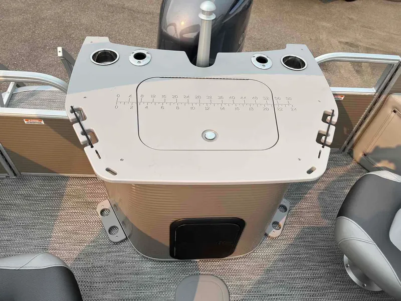 Slide: The Image of 2023 Bennington 22 SXSAPG boat console with cup holders and measurement markings. - 12