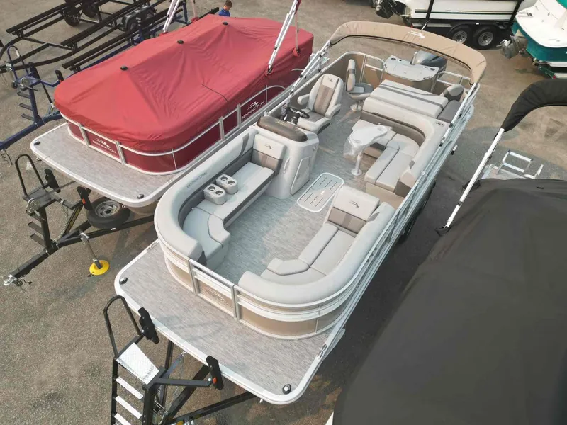 Slide: The Image of 2023 Bennington 22 SXSAPG pontoon boat with spacious seating and modern design. - 3