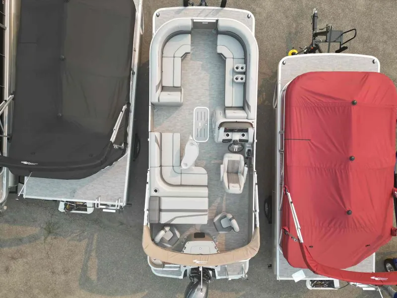 Slide: The Image of 2023 Bennington 22 SXSAPG pontoon boat, aerial view, showcasing seating and layout. - 9