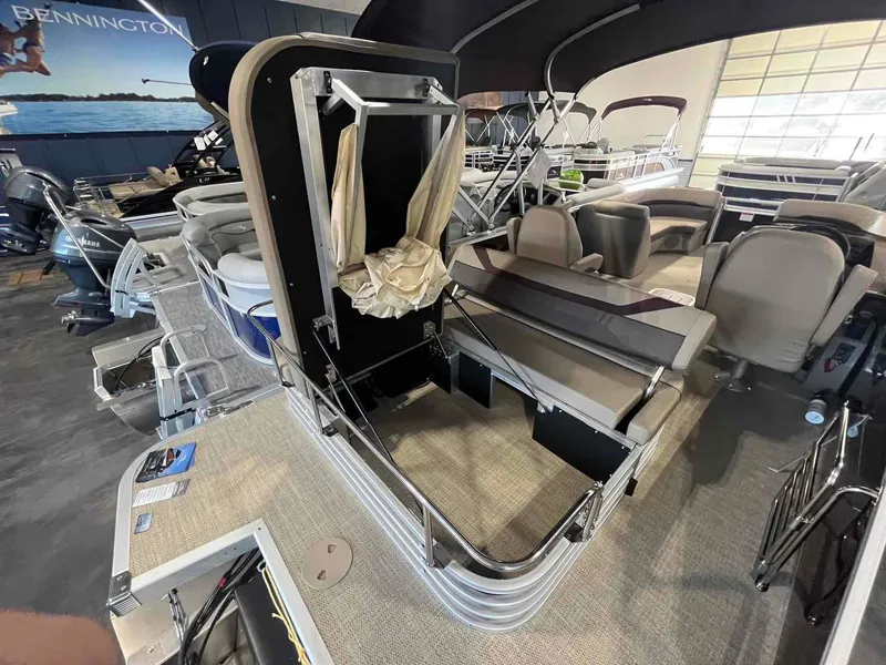 Slide: The Image of 2024 Bennington 22 SXSB pontoon boat interior with seating and storage features. - 12