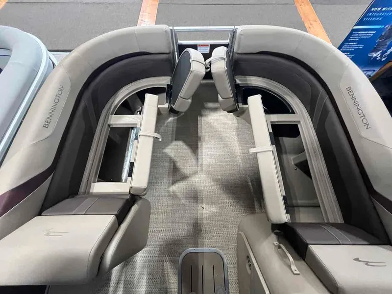 Slide: The Image of 2024 Bennington 22 SXSB pontoon boat interior with plush seating and modern design. - 13