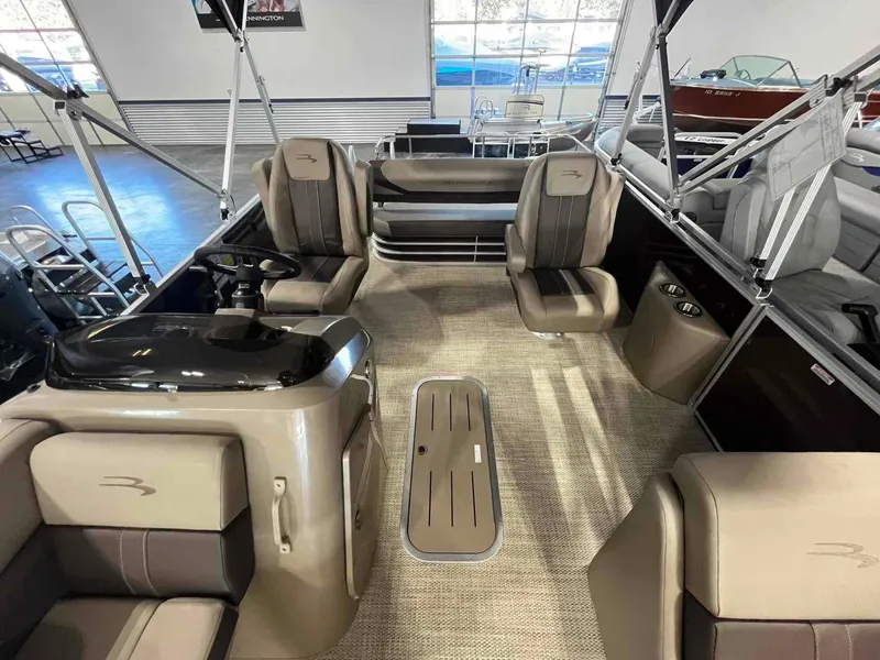 Slide: The Image of 2024 Bennington 22 SXSB pontoon boat interior with plush seating and modern design. - 3