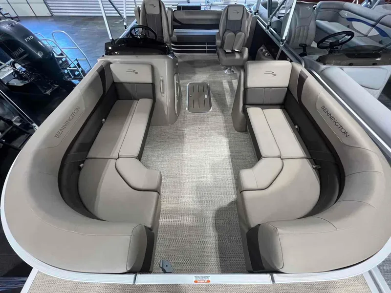 Slide: The Image of 2024 Bennington 22 SXSB pontoon boat interior with beige seating and modern design. - 4