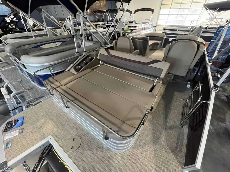Slide: The Image of 2024 Bennington 22 SXSB pontoon boat interior with seating and cup holders. - 6