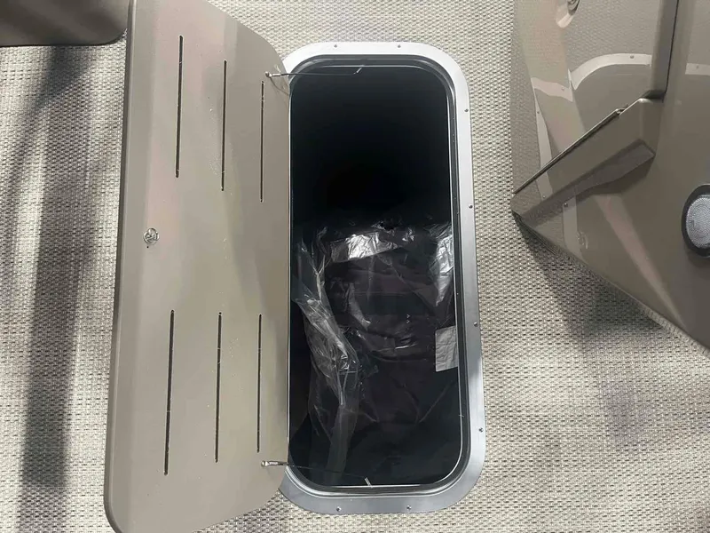 Slide: The Image of Open storage compartment on 2024 Bennington 22 SXSB boat. - 7