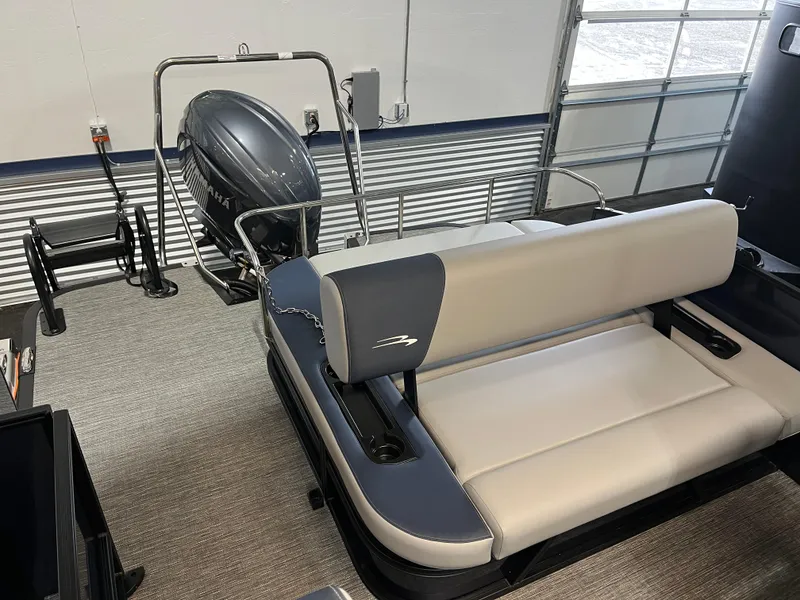 Slide: The Image of 2024 Bennington 22SSB-SPS pontoon boat interior with Yamaha outboard motor. - 14