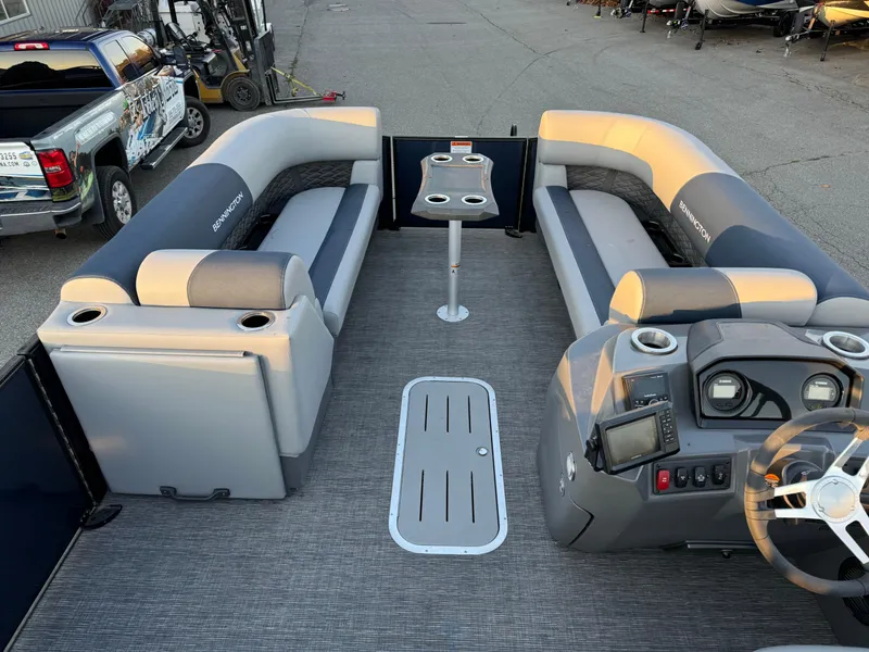 Slide: The Image of 2024 Bennington 22SSB-SPS pontoon boat interior with seating and helm. - 5