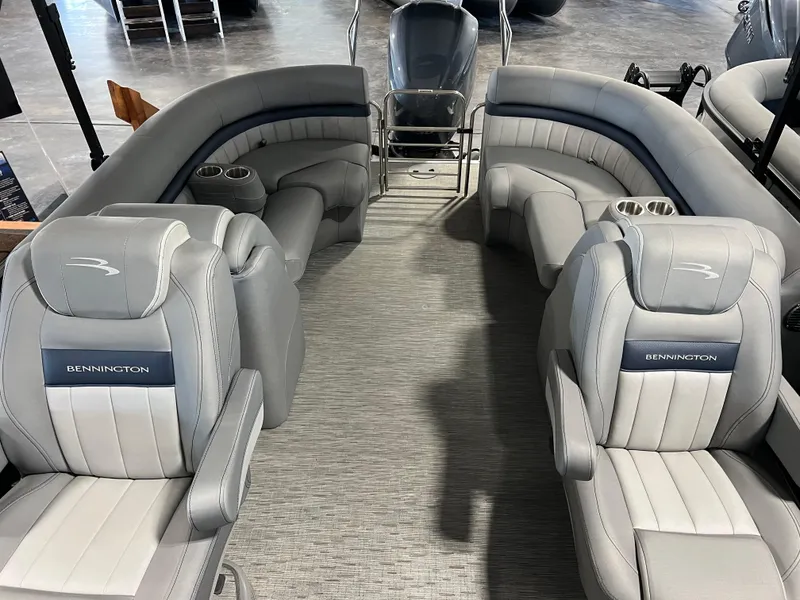 Slide: The Image of 2023 Bennington 23 LXFB boat interior with luxurious gray seating and cup holders. - 6