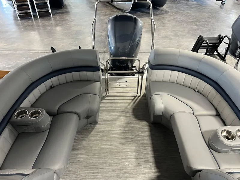 Slide: The Image of 2023 Bennington 23 LXFB pontoon boat interior with plush seating and cup holders. - 7