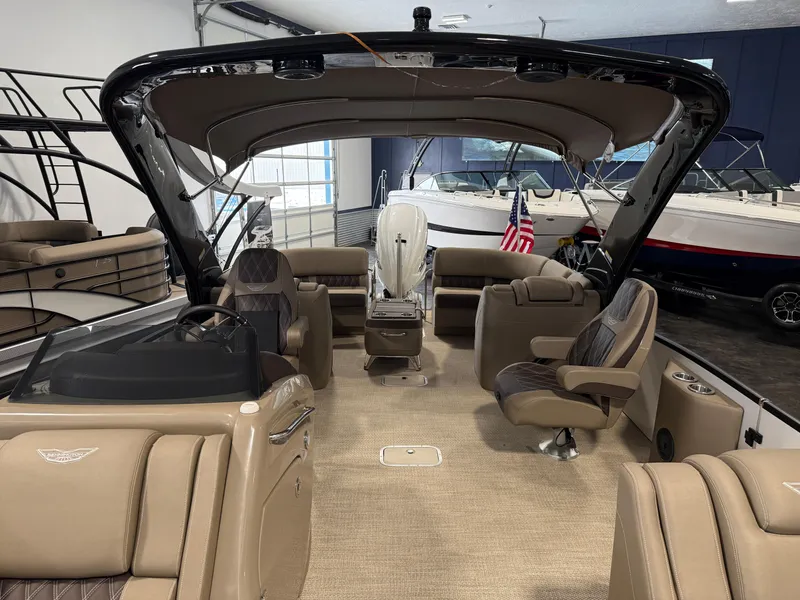Slide: The Image of 2024 Bennington 28 QXFBAX1 pontoon boat interior with luxurious seating and modern design. - 14