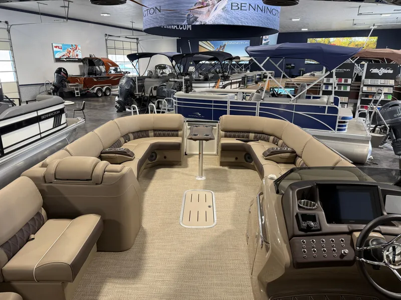 Slide: The Image of 2024 Bennington 28 QXFBAX1 pontoon boat interior with luxurious seating and modern dashboard. - 18