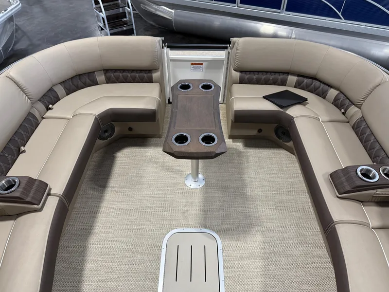 Slide: The Image of 2024 Bennington 28 QXFBAX1 boat interior with luxurious seating and table. - 19