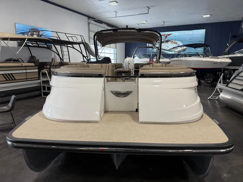 Slide: The Image of 2024 Bennington 28 QXFBAX1 pontoon boat displayed in showroom. - 3