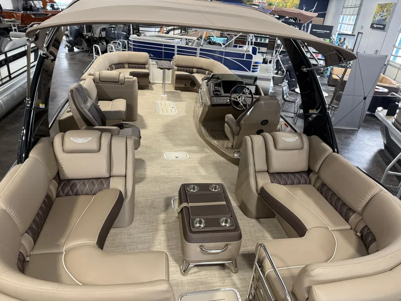 Slide: The Image of Luxurious interior of 2024 Bennington 28 QXFBAX1 pontoon boat with plush seating and helm. - 9