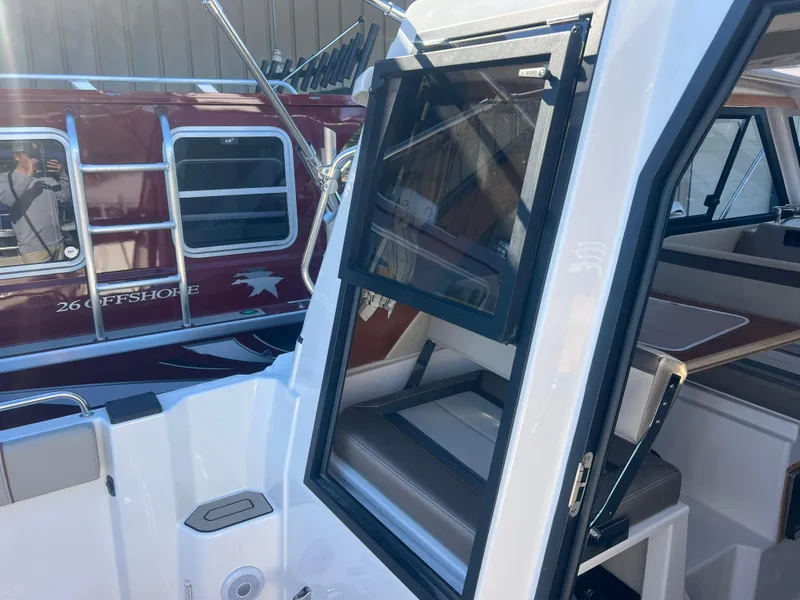 Slide: The Image of 2023 Cutwater C-248 C boat interior with open window and seating area. - 11