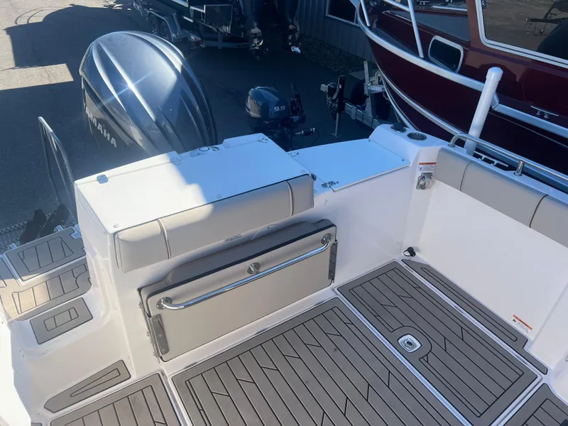 Slide: The Image of 2023 Cutwater C-248 C boat deck with Yamaha outboard motor, featuring sleek design and seating. - 21