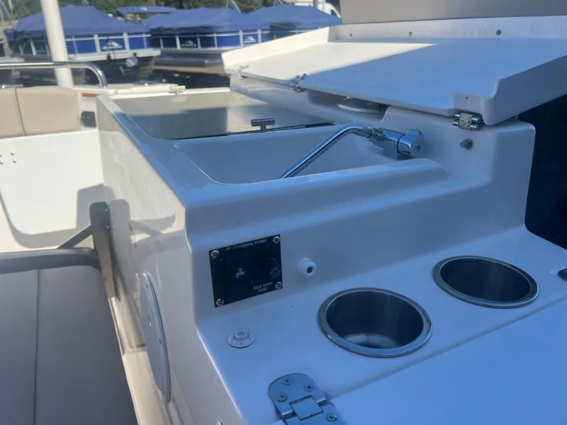 Slide: The Image of 2023 Cutwater C-248 C boat interior with sink and cup holders. - 24