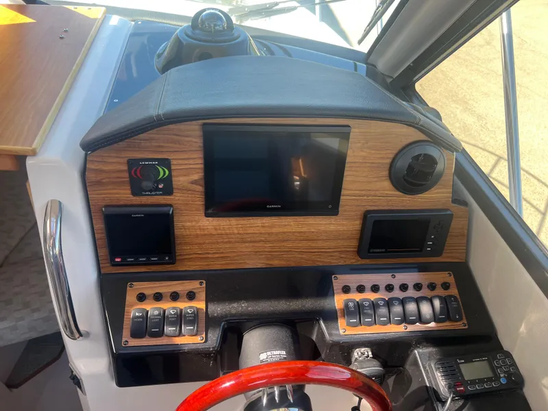 Slide: The Image of 2023 Cutwater C-248 C helm with navigation screens and controls. - 36