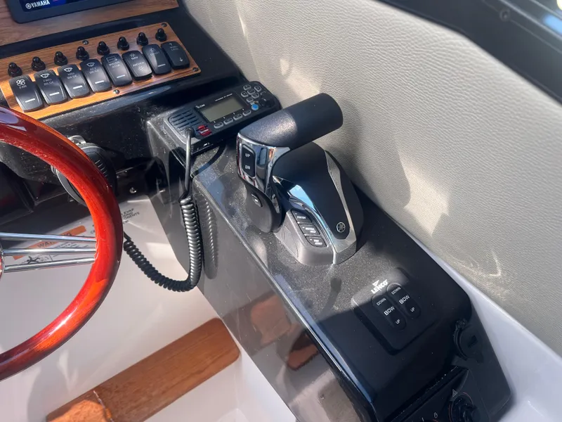 Slide: The Image of 2023 Cutwater C-248 C helm with Yamaha controls and wood steering wheel. - 37