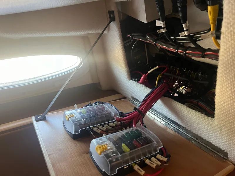 Slide: The Image of 2023 Cutwater C-248 C electrical panel with wiring and fuse boxes. - 42