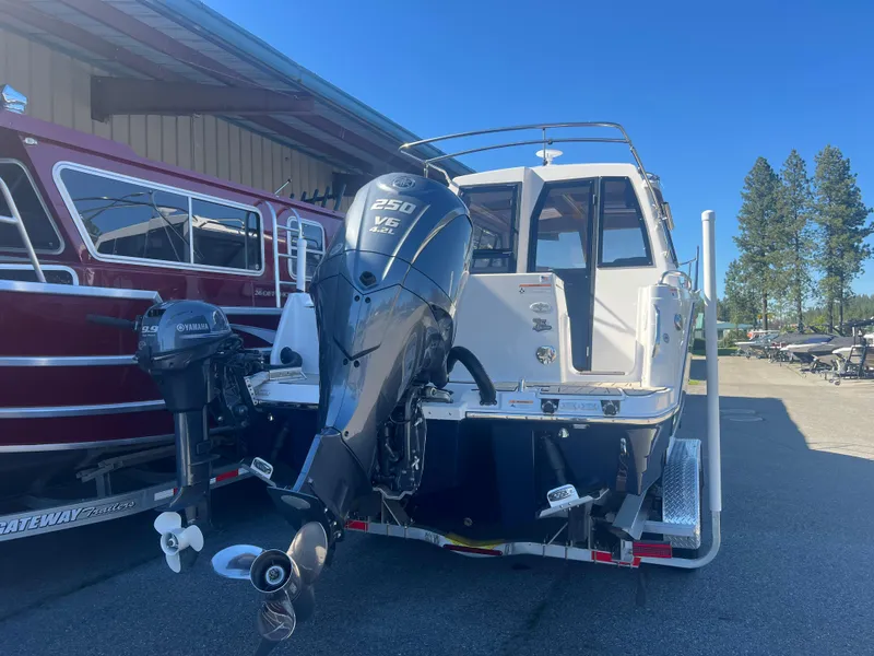 Slide: The Image of 2023 Cutwater C-248 C boat with Yamaha outboard motor, parked outdoors. - 6