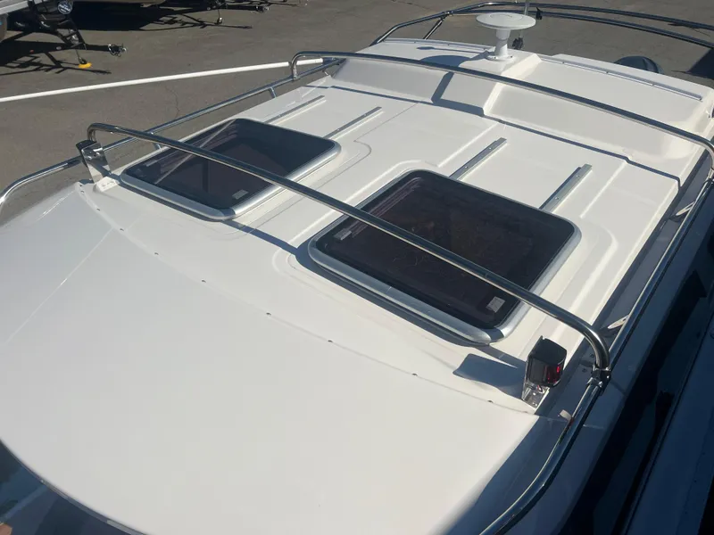 Slide: The Image of 2023 Cutwater C-248 C boat roof with hatches and railing in sunlight. - 9