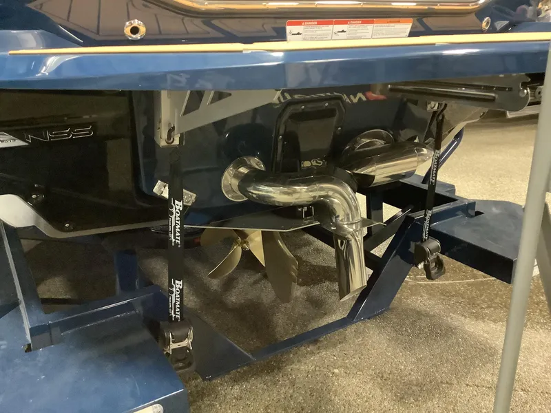 Slide: The Image of 2025 Nautique G23 boat propeller and exhaust system in close-up view. - 15