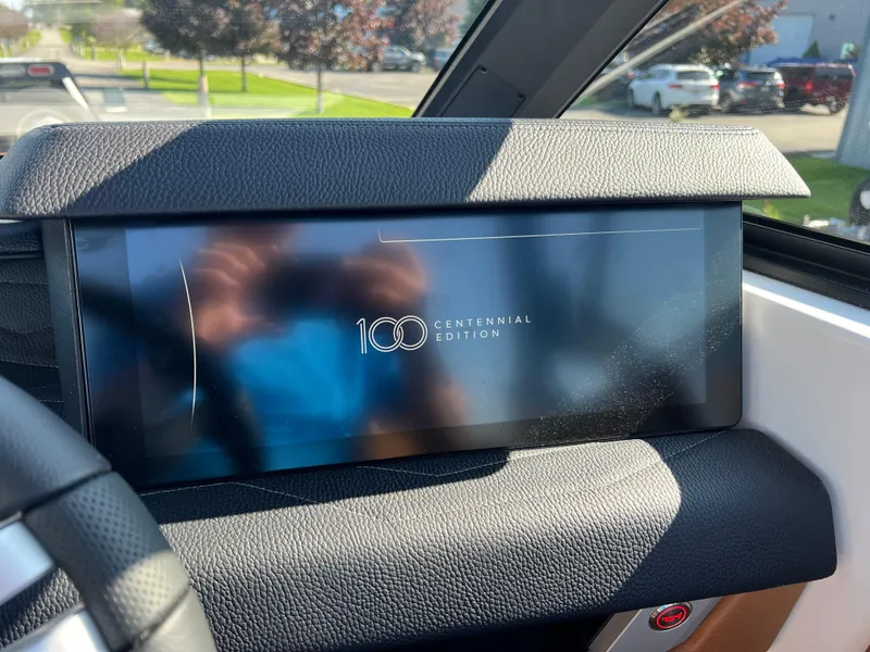 Slide: The Image of 2025 Nautique G23 Centennial Edition dashboard display in a modern boat interior. - 23