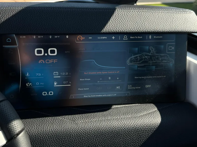 Slide: The Image of 2025 Nautique G23 dashboard display with speed, temperature, and control settings. - 25