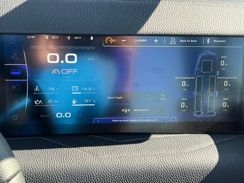Slide: The Image of 2025 Nautique G23 dashboard display showing speed, temperature, and ballast settings. - 26