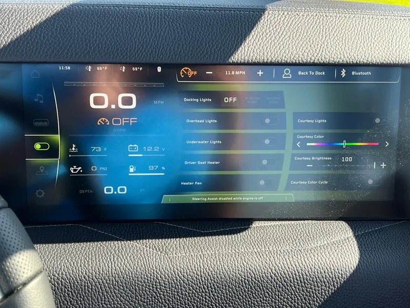 Slide: The Image of 2025 Nautique G23 dashboard display with speed, temperature, and lighting controls. - 27