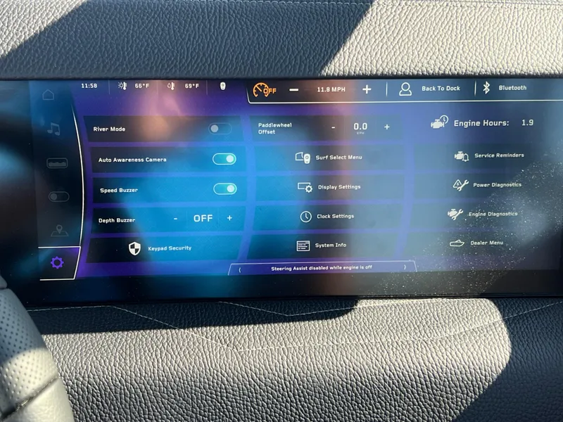 Slide: The Image of 2025 Nautique G23 dashboard display with various control settings and diagnostics options. - 28