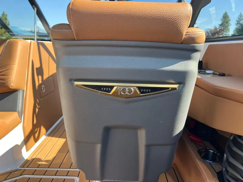 Slide: The Image of 2025 Nautique G23 boat interior with tan leather seating and sleek design. - 42