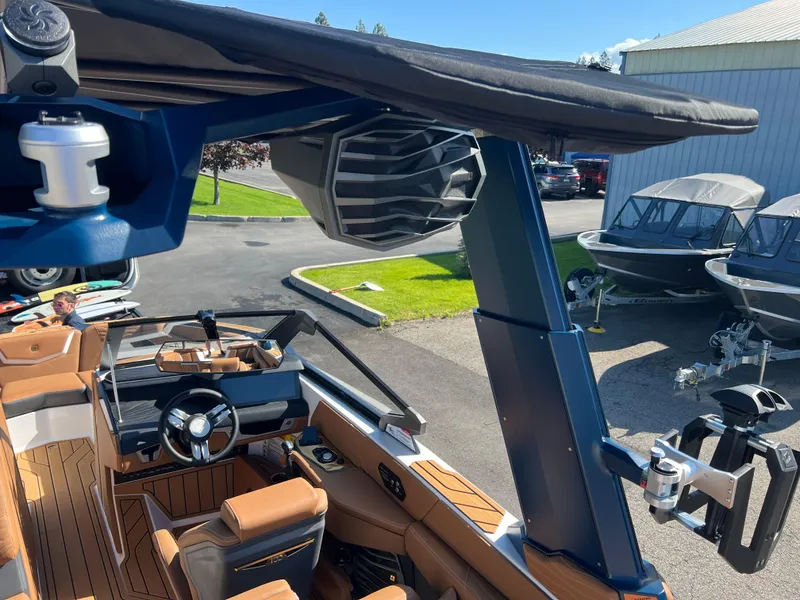 Slide: The Image of 2025 Nautique G23 boat interior with advanced sound system and luxurious seating. - 45