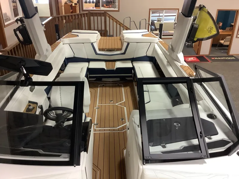 Slide: The Image of 2025 Nautique G25 boat interior with luxurious seating and modern design. - 10