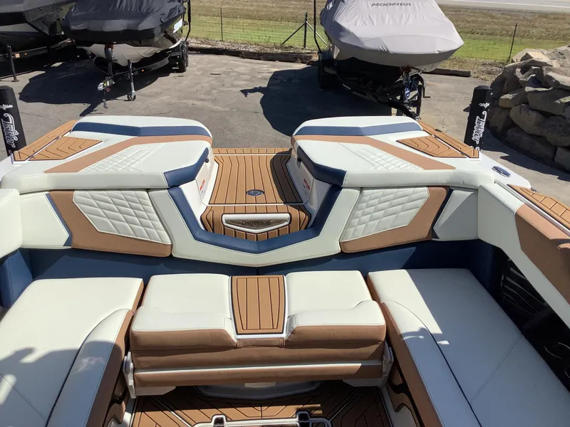 Slide: The Image of 2024 Nautique Super Air G23 boat interior with luxurious seating and modern design. - 17