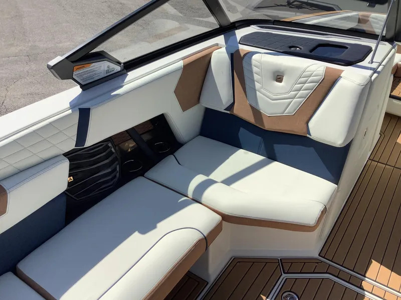 Slide: The Image of 2024 Nautique Super Air G23 interior with luxurious seating and modern design. - 20