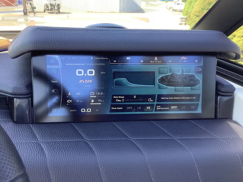 Slide: The Image of 2024 Nautique Super Air G23 dashboard display with digital controls and navigation features. - 22