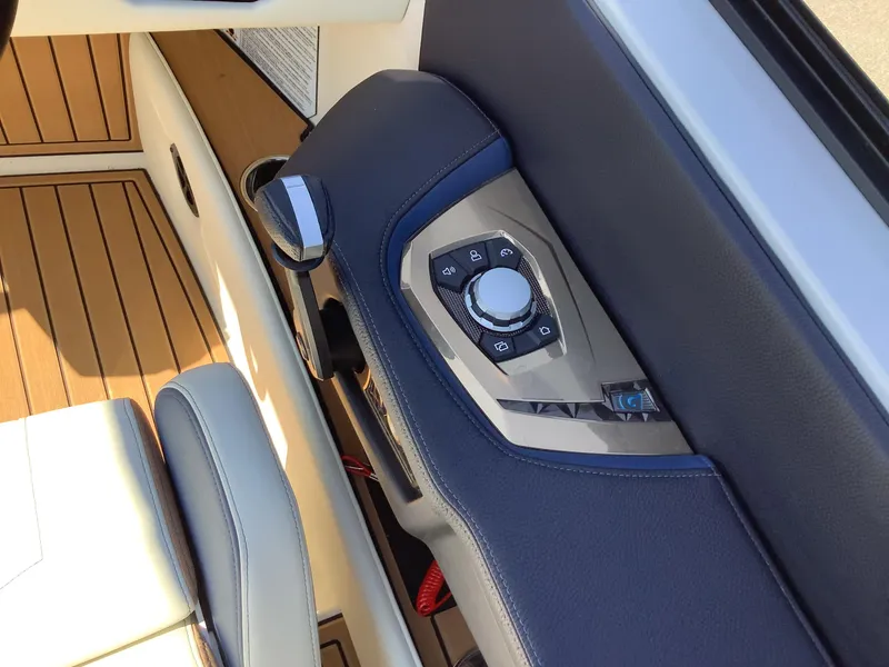 Slide: The Image of 2024 Nautique Super Air G23 boat interior control panel with sleek design. - 23