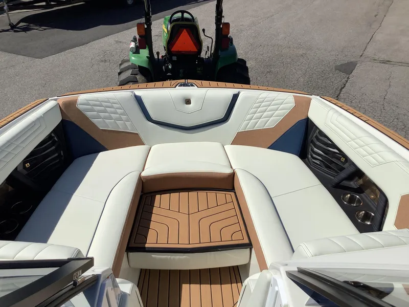 Slide: The Image of 2024 Nautique Super Air G23 boat interior with luxurious seating and stylish design. - 28